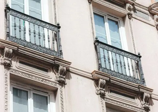 Facade of classic building with french windows